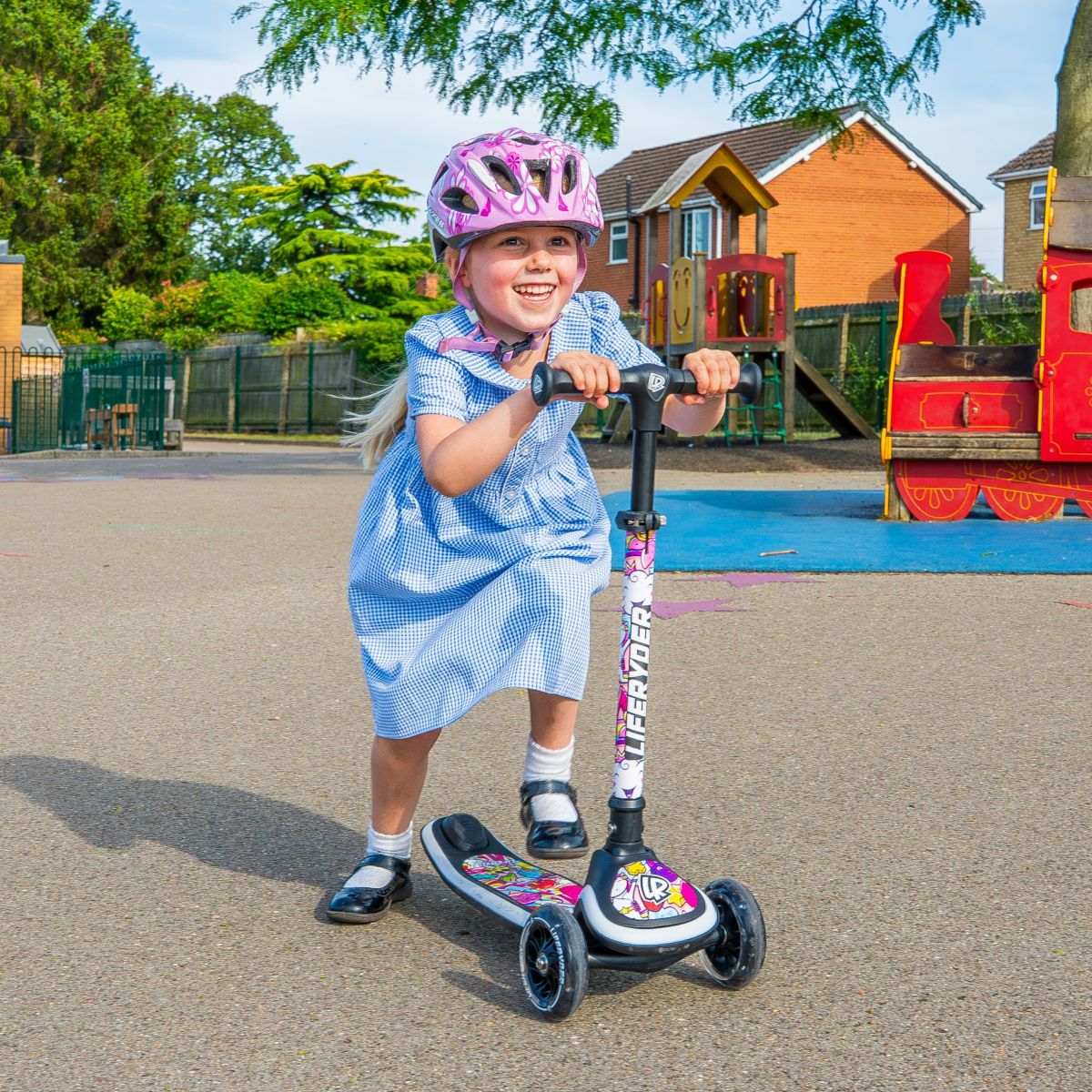 Child riding a LIFERYDER HALO 3 wheel scooter in a school playground