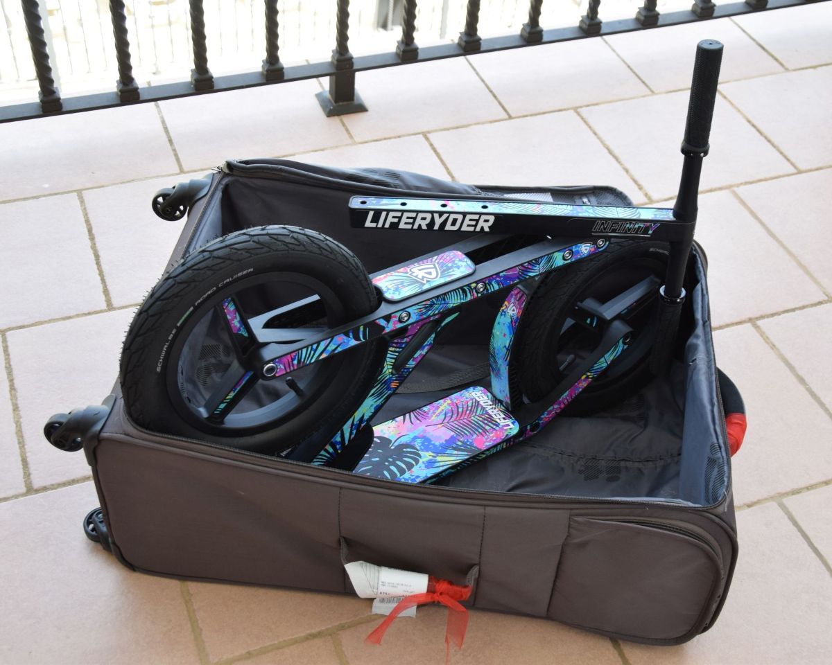 Folded LIFERYDER INFINITY big wheel scooter in a carry case for transport