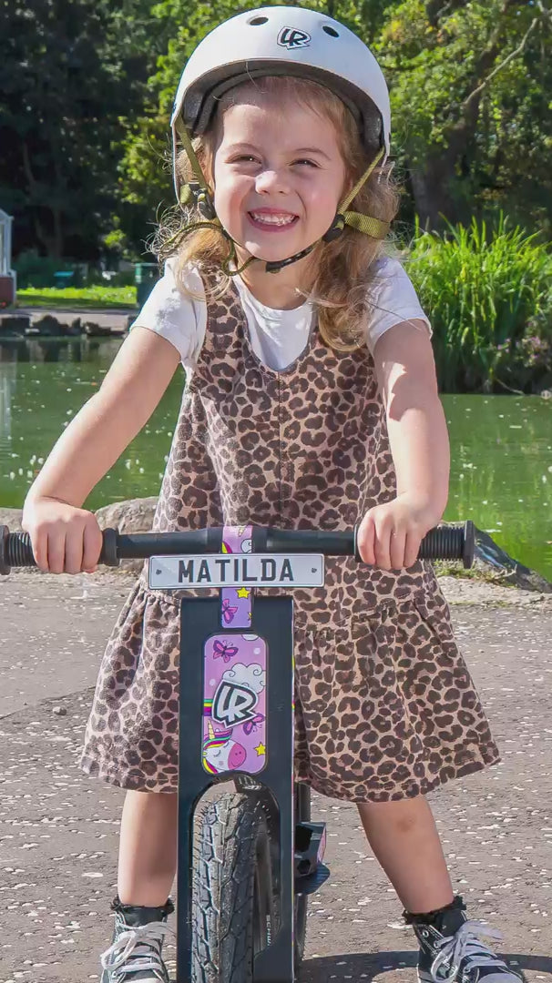 Children riding LIFERYDER VOGUE balance bikes together in a park